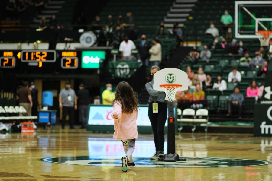 A young CSU fan plays a game during halftime.
