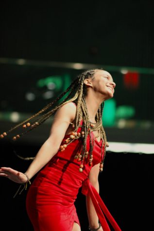 A model flips her hair as she walks the runway.