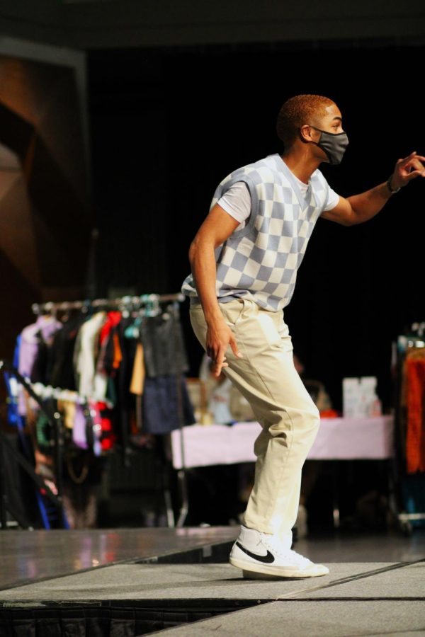 An audience member dances on stage.