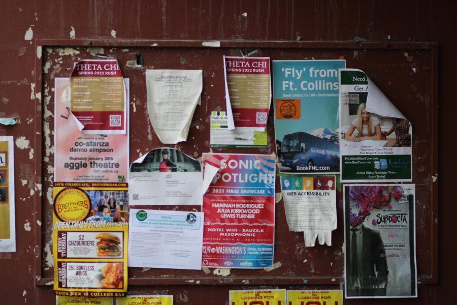 An array of flyers hangs from a bulletin board outside the C wing of the Andrew G. Clark Building Feb. 2, 2022.