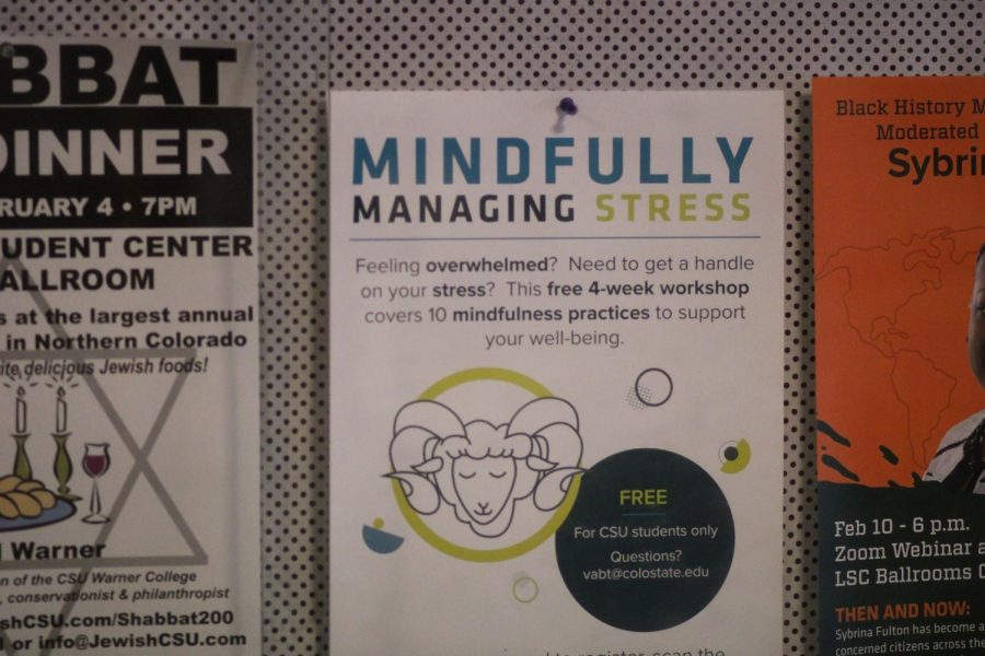A student-help flyer hangs from a bulletin board inside the Clark C building.