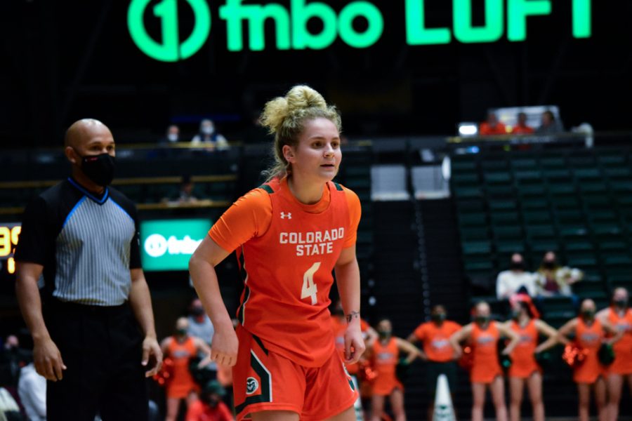 Mckenna Hofschild (4)looking for the ball to establish a play during a heated home game against the Utah State Aggies.
