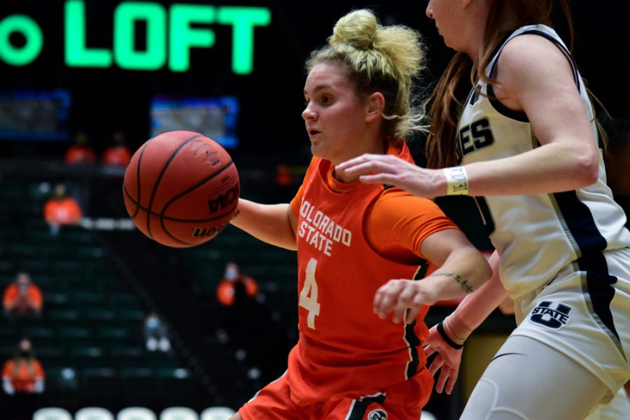 Mckenna Hofschild (4) Colorado State Rams women's basketball guard on offense with the ball during a home game against the Utah State Aggies