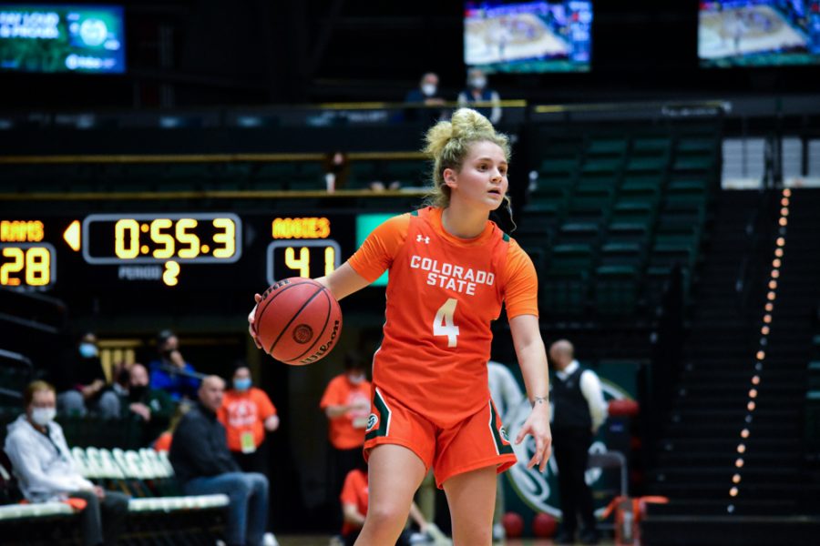 Mckenna Hofschild (4) Colorado State Rams women's basketball guard dribbling the ball down court during a home game against the Utah State Aggies