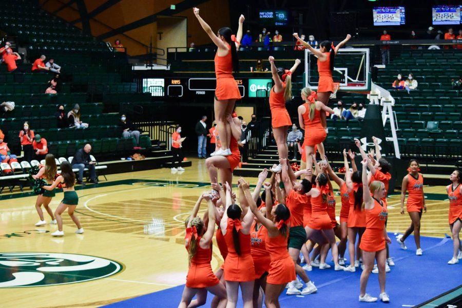 Colorado State University Cheerleaders performing at halftime in the Moby Arena during the orange out game.