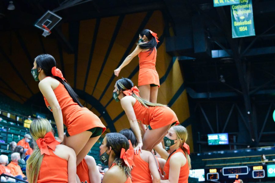 Colorado State University Cheerleaders fly high at Moby Arena during the orange out game.