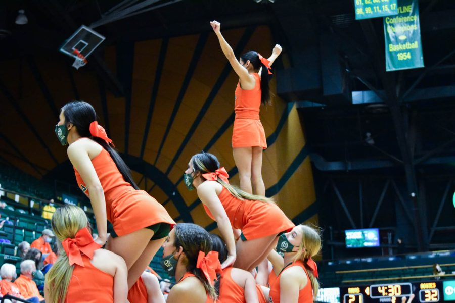 Colorado State University Cheerleaders fly high at Moby Arena during the orange out game.
