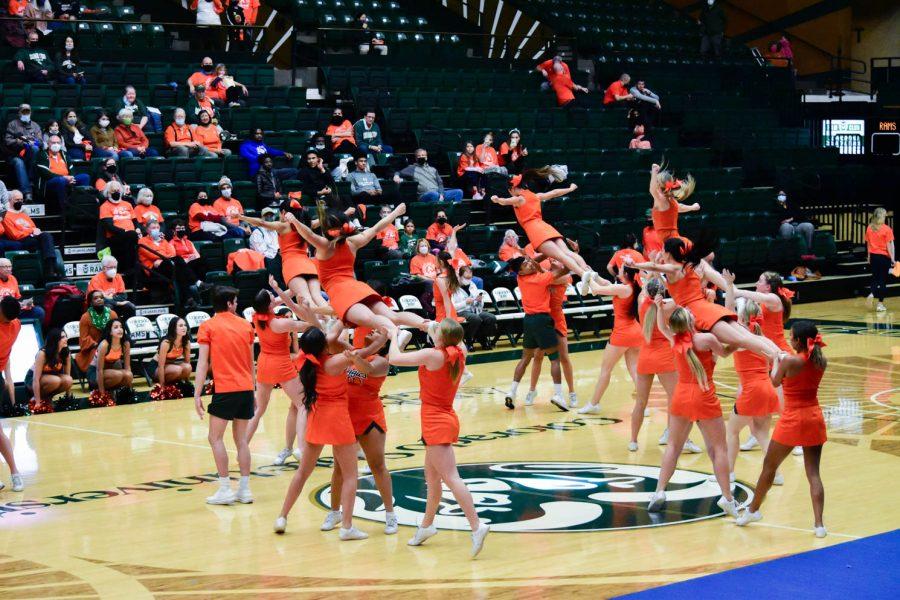 Colorado State University Cheerleaders performing at halftime in the Moby Arena during the orange out game.