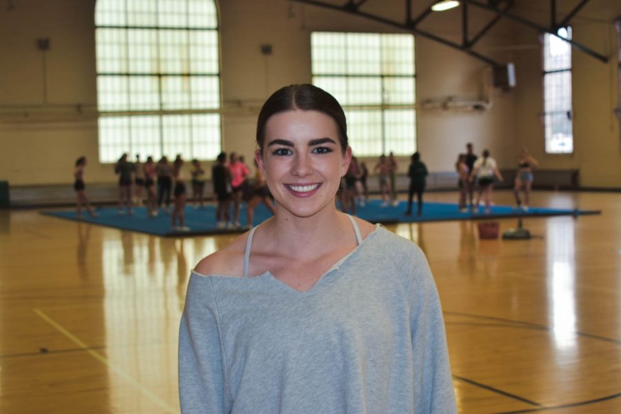 Savannah Woods senior cheerleader at Colorado State University posing for a portrait during one of her final practices as a CSU cheerleader.