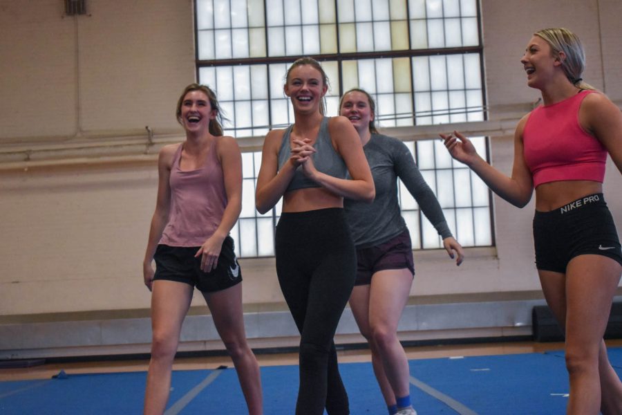 Senior cheerleader, Kaiya Jenkins walking off the mat during practice in happiness after successfully hitting a stunt in the Glen Morris Field House on Feb. 14, 2022.