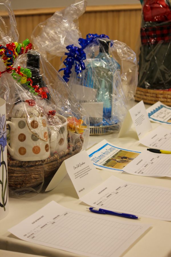 The Let Your Light Shine Benefit concert auction table had many different packages.