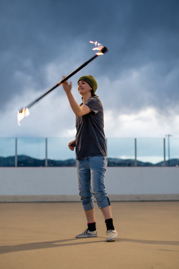 Hillary Johnson a student at Colorado State university practices her fire twirling on the Inter Mural fields March. 4.