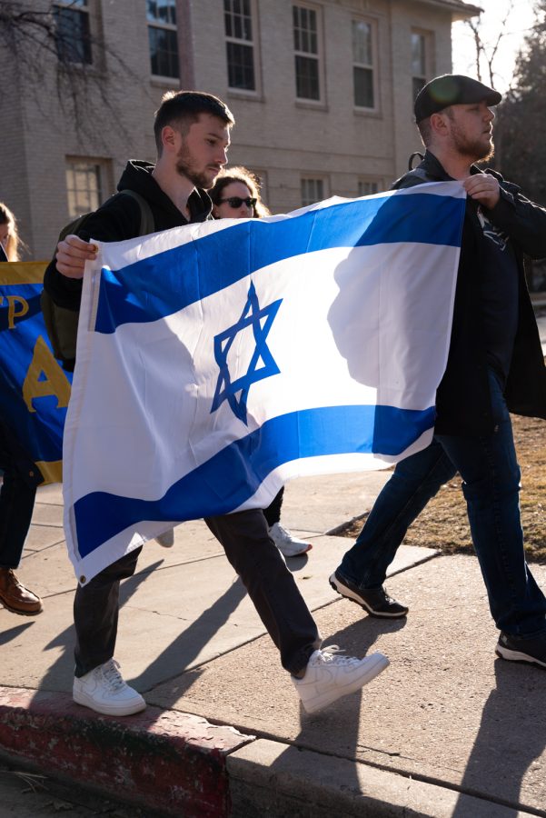 Justin Deutsch and Jacob Margo-Ginsberg, Brother-At-Large, of Colorado State University’s, Alpha Epsilon Pi, Jewish fraternity lead The Holocaust Walk to Remember wielding an Israeli flag Mar 4. “The walk to remember is the symbolic marches that people had to do to their deaths,” Margo-Ginsberg stated, “we relive those in a sense carrying around with us our fraternity flag and the flag of Israel, the flag of the Jewish people.”