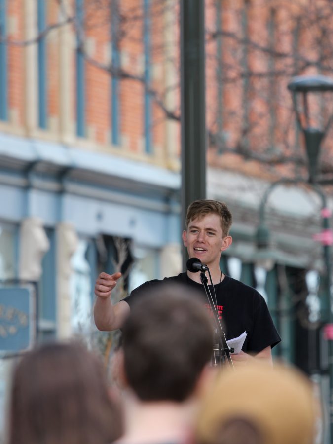 Ehret Nottingham speaks to the crowd at the climate strike in Old Town Fort Collins.