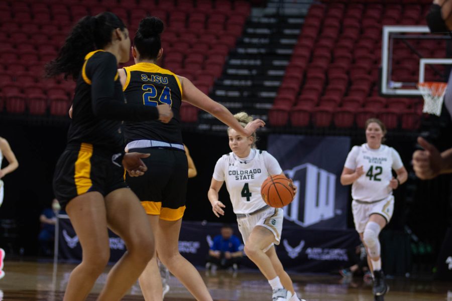 Mckenna Hofschild (4) runs down the court with the ball during the first game of the Mountain West Tournament against the San Jose Spartans. Rams win 82-43.