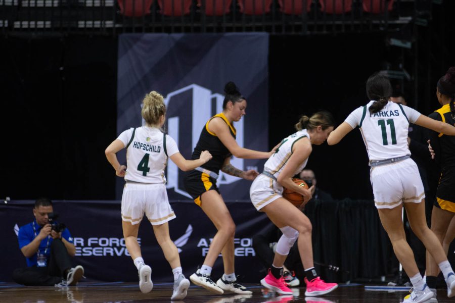 Sydney Mech (24) clutches the ball during a heated game against the San Jose Spartans at the Mountain West Tournament in Las Vegas NV, Mar. 6, 2022.
