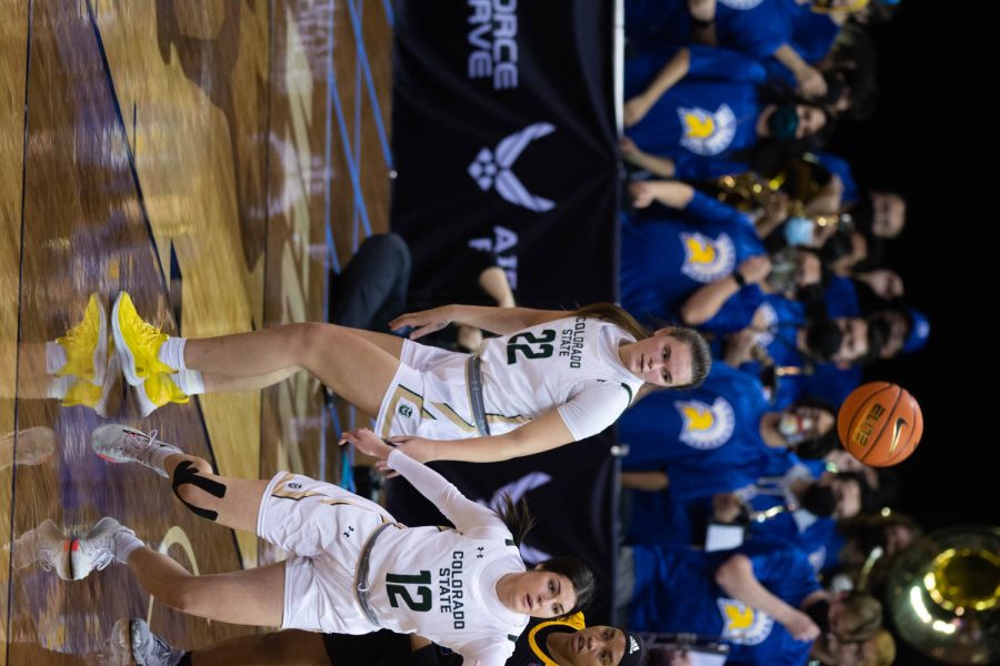 Cali Clark (22) and Clara Gomez (12) fighting for the ball while they play the San Jose Spartans during the first game of Mountain West Tournament.