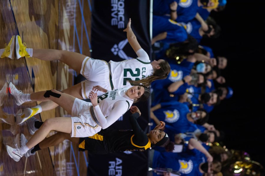 Cali Clark (22) and Clara Gomez (12) fighting for the ball while they play the San Jose Spartans during the first game of Mountain West Tournament, Mar. 6, 2022.
