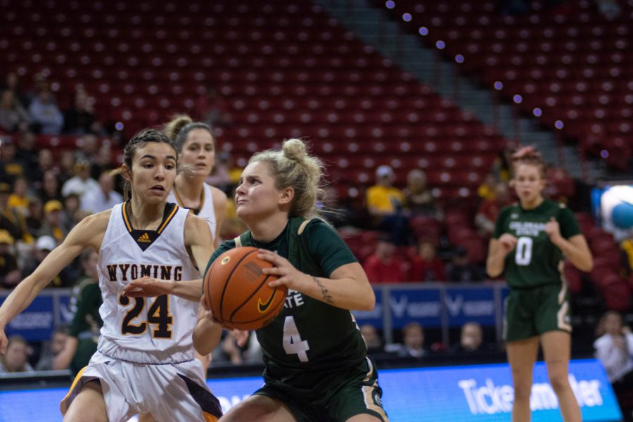 Mckenna Hofschild (4) prepares to shoot the ball during a close game against the Wyoming Cowgirls at the Thomas and Mac Center Mar. 7, 2022.