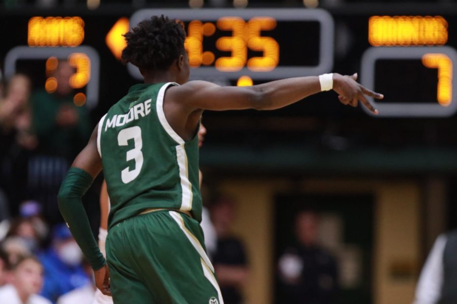 Kendle Moore (3) holds up three fingers after hitting a 3-pointer during the first half of play as Colorado State University takes on Boise State University at Moby Arena March 5. Moore had 13 points in the first half.