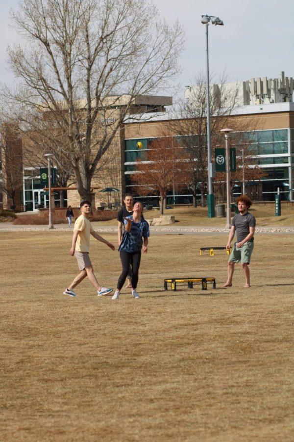 CSU students play Spikeball on the IM fields.