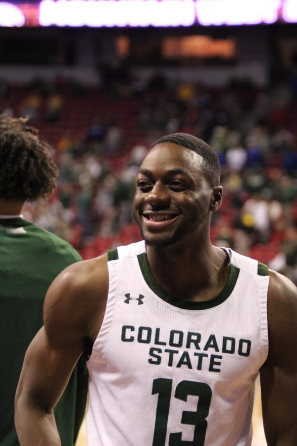 Chandler Jacobs (13, guard), smiles to a friend on the sidelines during Colorado States warm-up.