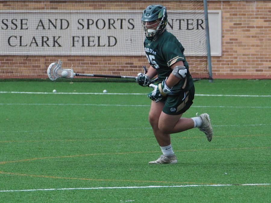 Colorado state Face-off Specialist Christopher Reed moves the ball upfield against the University of Texas, March 13, 2022.