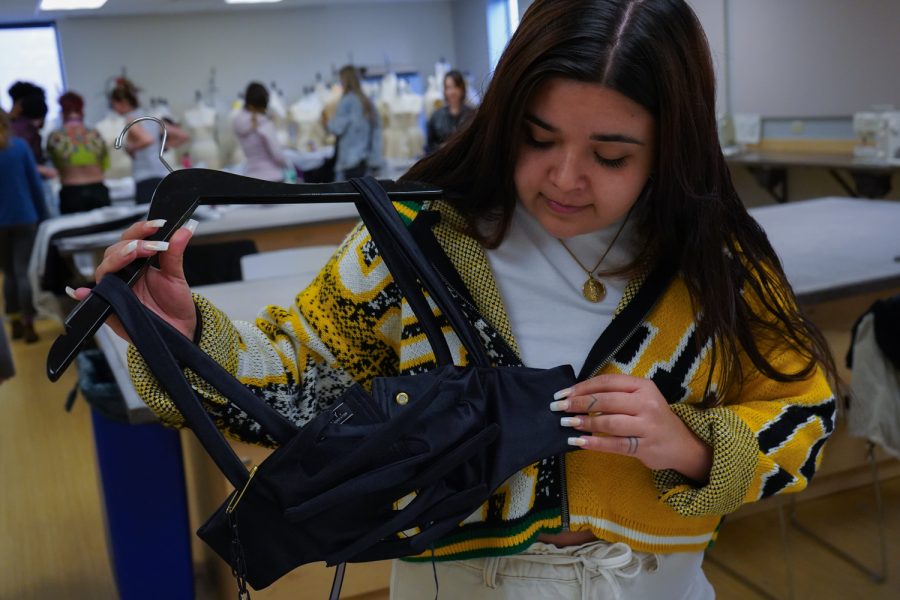 We defy ourselves for the world to see piece created by Cynthia Rodriguez for the spring Colorado State University Fashion show. This detailed clothing piece along with many others were tried on during the first fitting for the CSU fashion show