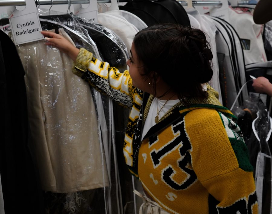 Cynthia Rodriguez checks out the pieces she created for the spring Colorado State University fashion show. Her clothing pieces along with many others were tried on during the first fitting for the CSU fashion show on Apr. 5, 2022. Photo by Michael Giles
