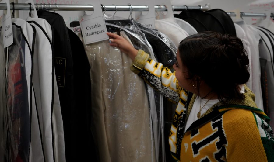 Cynthia Rodriguez checks out the pieces she created for the spring Colorado State University fashion show. Her clothing pieces along with many others were tried on during the first fitting for the CSU fashion show