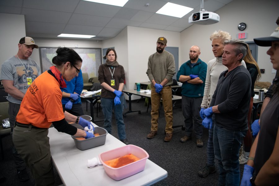 5. Debbie Francis, medical officer for Larimer County Search and Rescue demonstrates how to pack a wound to students of LCSAR basic search and rescue training course March. 5.