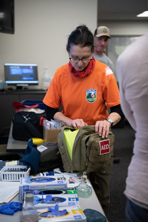 Debbie Francis demonstrates how to pack a wound, perform CPR and use an Automatic Electronic Defibrillator to students of LCSAR basic search and rescue training course March 5.