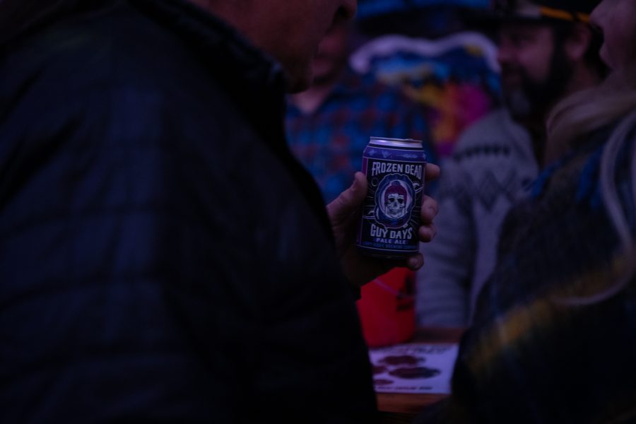 A Participant of Frozen Dead Guy Days holds a Lumpy Ridge Brewing Company Pale Ale brewed exclusively for the festival March 18.
