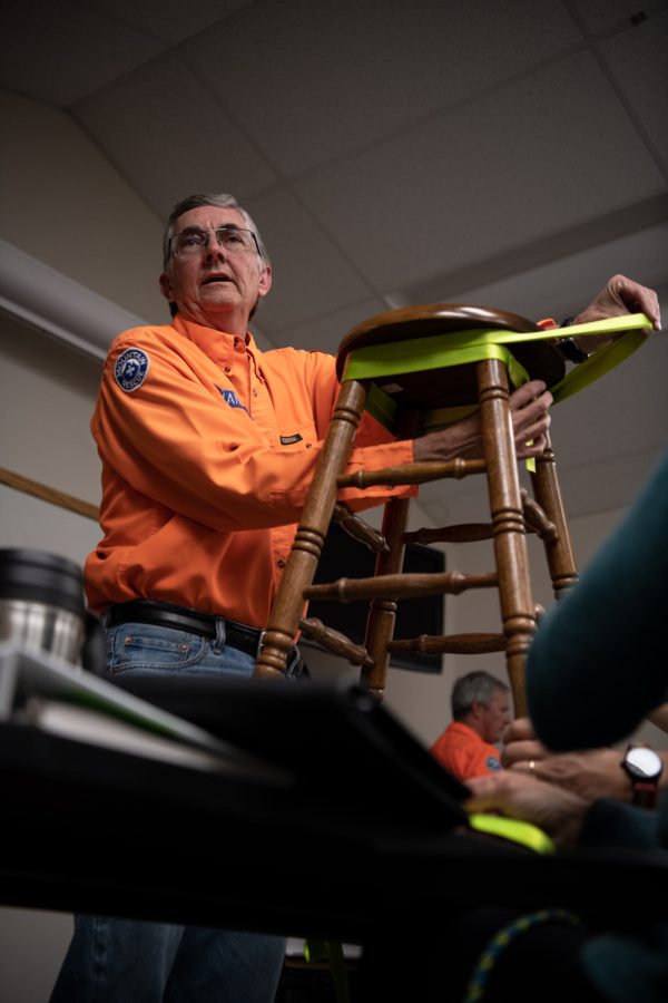 Scott Evans demonstrates the “Wrap Three Pull Two” climbing anchor to students of the Larimer County Search and Rescue basic search and rescue training program March 30.