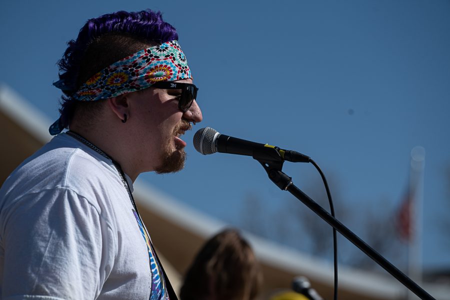 Peter Koschnitzke, of the band Cosmic Problem, sings an original song during K-Colorado State University’s FoolsFest behind Lory Student Center Apr 1.