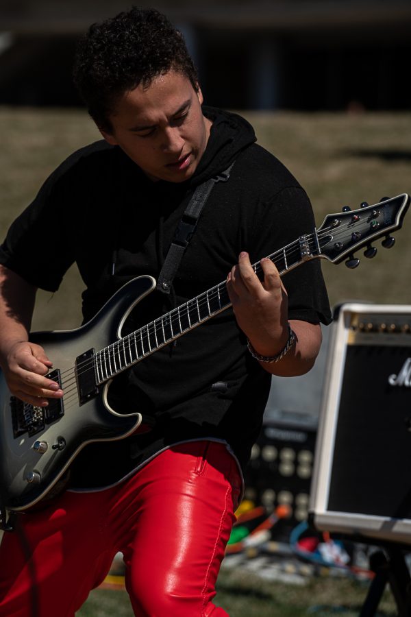 Bran Schneider, of the band Hygeia, plays a guitar solo at K-Colorado State University’s FoolsFest behind Lory Student Center co-hosted by Blast N Scrap Apr 1.
