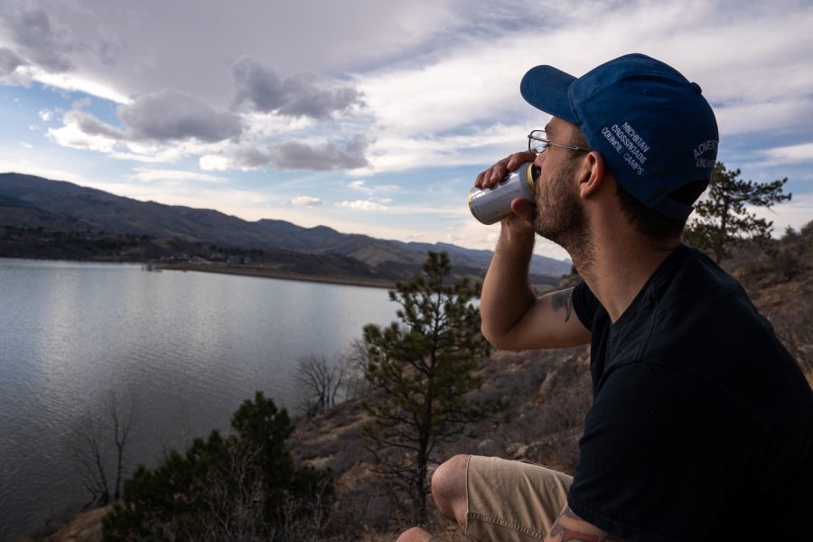 Photo Illustration of Dylan Medina, a Colorado State University chemistry major, drinking a beer at the Horsetooth Reservoir Apr 2.