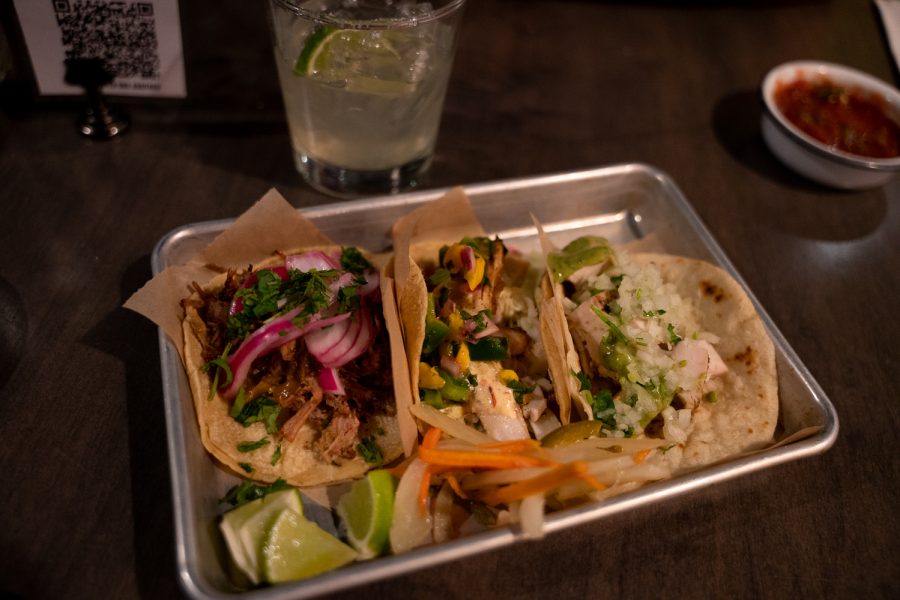 Tacos A La Carte with Pan Seared Mahi Mahi, Cilantro-Lime Grilled Chicken, Beer-Braised Carnitas and a Barrel Aged Big Tex drink ordered from Rio Grande Mexican Restaurant located at 149 West Mountain Street, Fort Collins, Colorado Apr 2.
