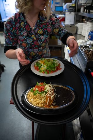 Jocelyn Mahuron, Staff Manager of Rio Grande Mexican Restaurant, prepares a customer’s order located at 149 West Mountain Street, Fort Collins, Colorado Apr 2.