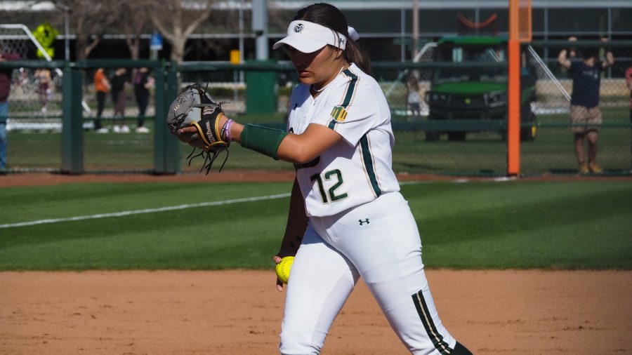 Colorado State pitcher Julia Cabral (12) prepares to pitch the ball against the University of New Mexico Lobos April 8, 2022.