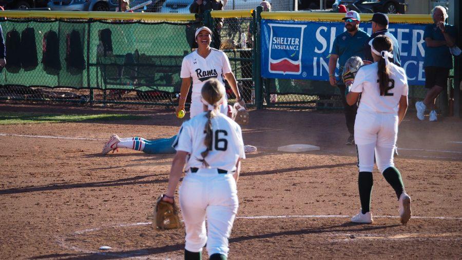 Colorado State infield Danielle Serna smiles as the rest of the Colorado State softball team celebrate closing the inning against the University of New Mexico, April 8, 2022.