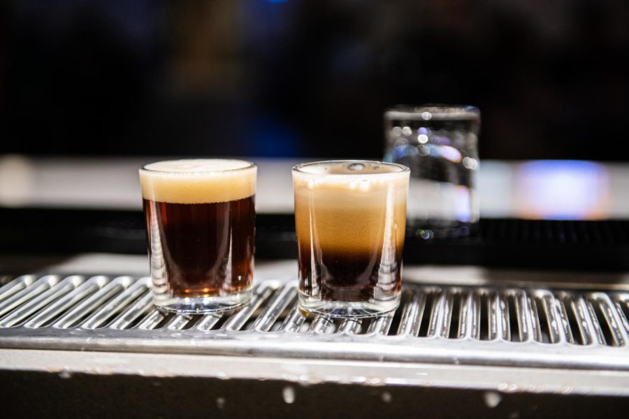 Two samples of beer sit behind the bar of the Ramskeller showing the difference in carbonation between standard brewing and nitro brewing