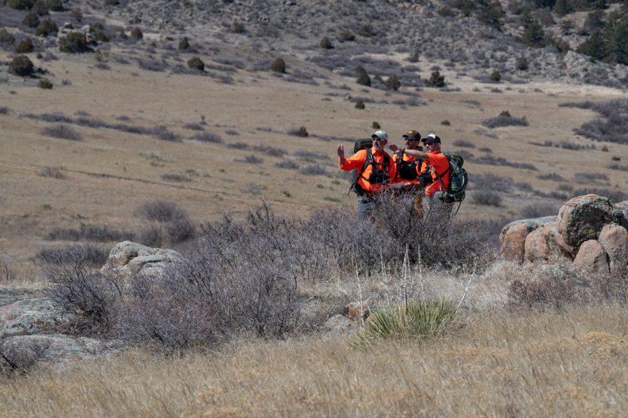 Tom Carney, Bob Townsend and Ben Draper regroup while conducting a mock search to reassess their plan April 9.