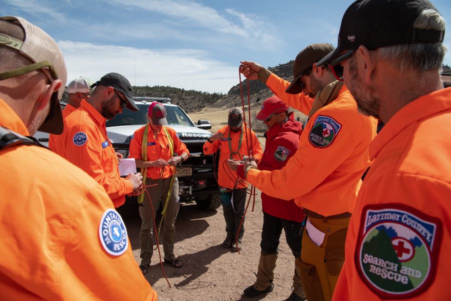 Larimer County Search and Rescue BASARTs are tested on their knots after conducting a mock search April 9.