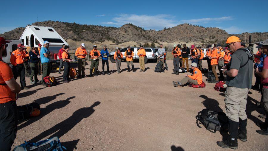 9. Basic search and rescue training students brief before conducting a mock search for nine missing persons April 9.
