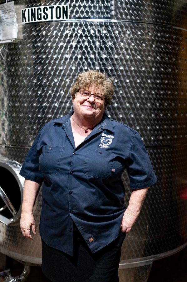 Jennifer Seiwald stands in front of her favorite fermentation tank called Kingston in Scrumpy's located in Old Town, Fort Collins
