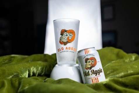 A pint glass and can of New Belgium Brewing's Old Aggie