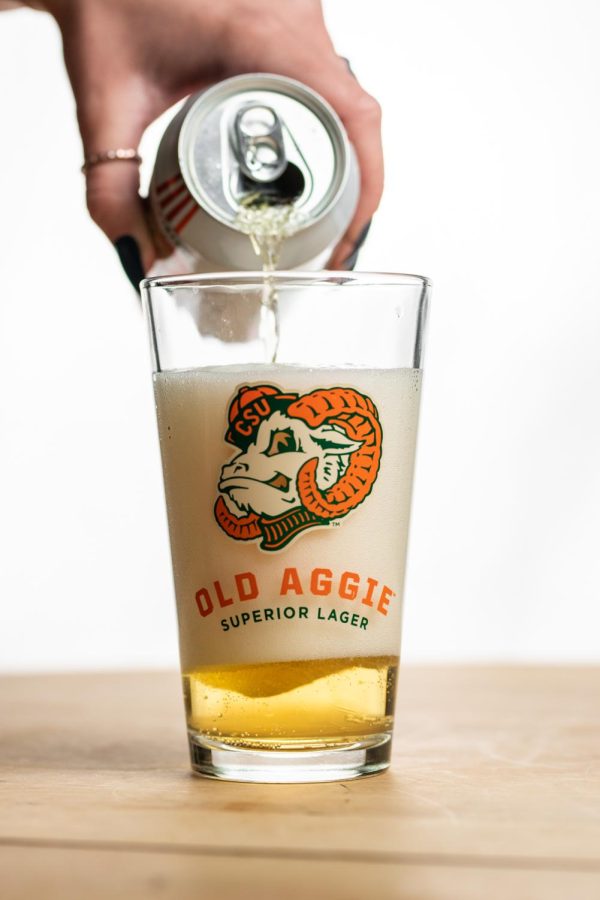 A can of New Belgium Brewings Old Aggie lager is poured into a pint glass