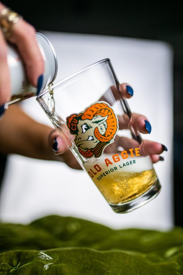 A can of New Belgium Brewing's Old Aggie lager is poured into a pint glass