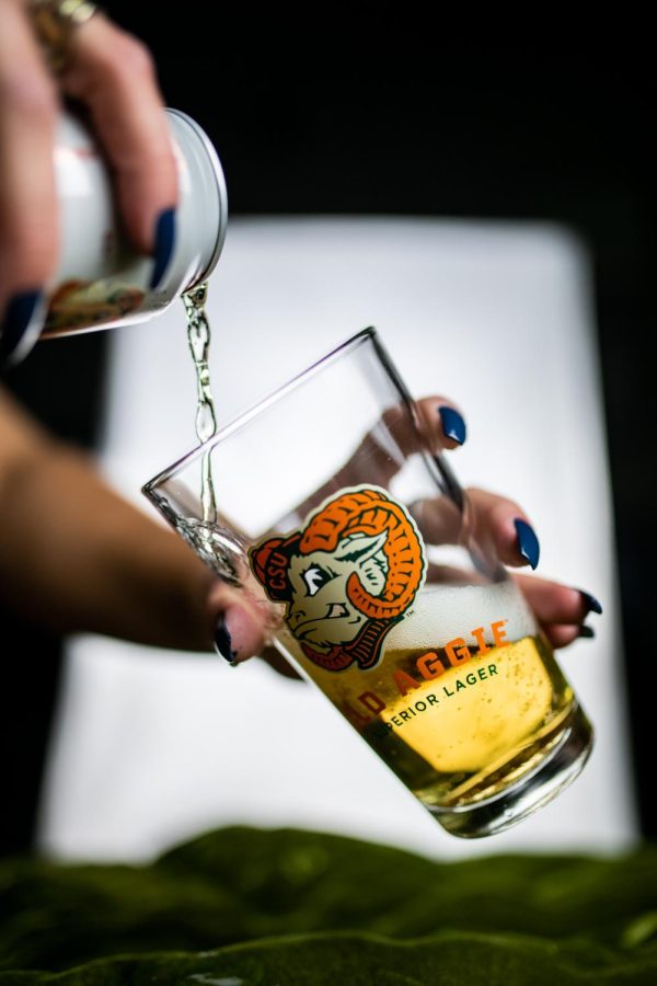 A can of New Belgium Brewing's Old Aggie lager is poured into a pint glass